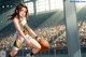 A woman in a basketball uniform dribbling a basketball on a court.